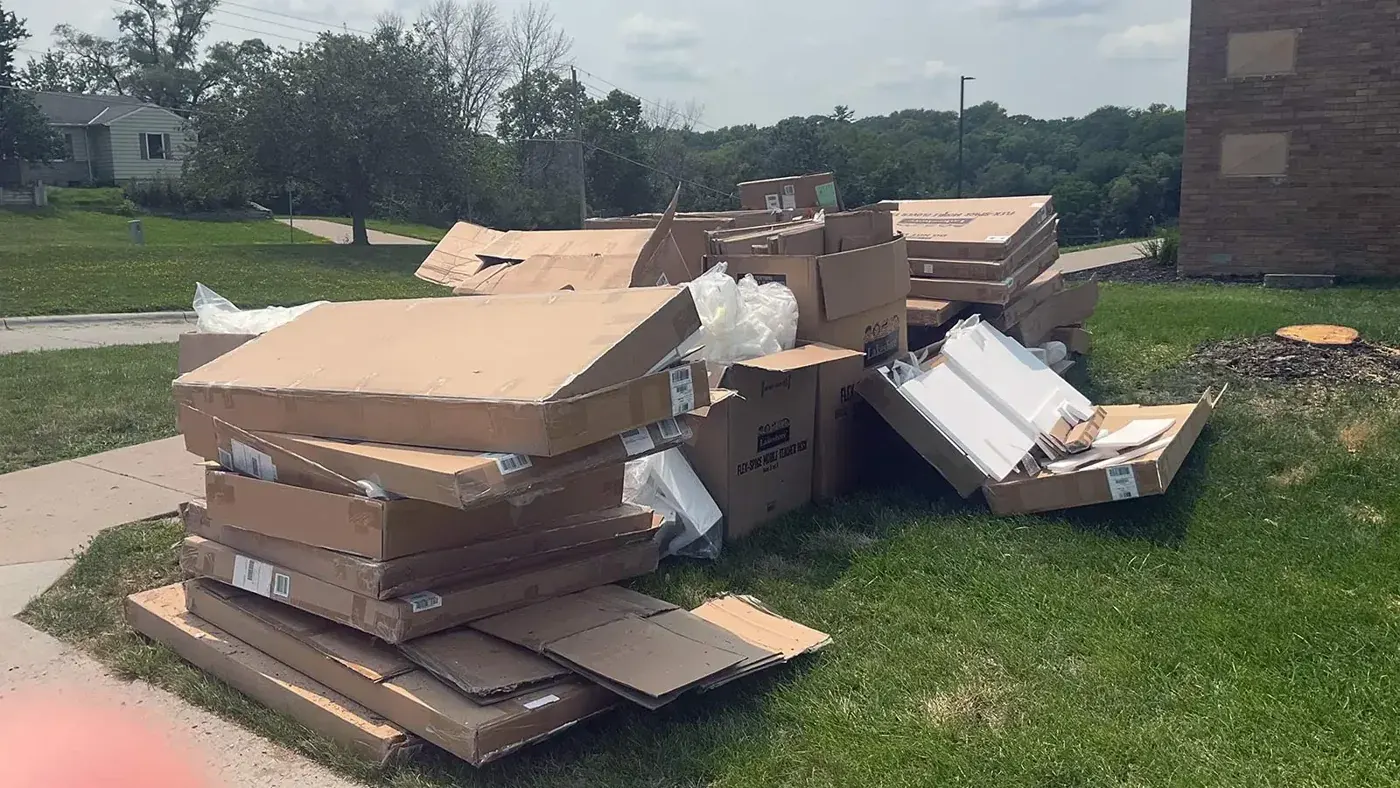 Boxes and bulk items piled outside for pickup, Omaha