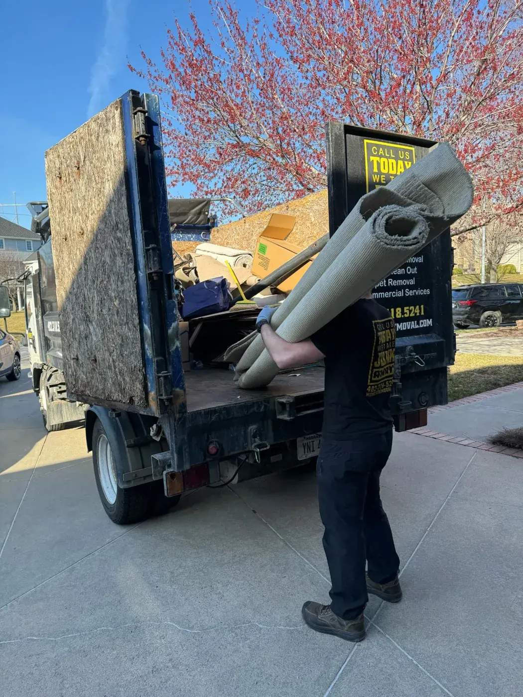 Carpet rolls loaded for disposal, Omaha