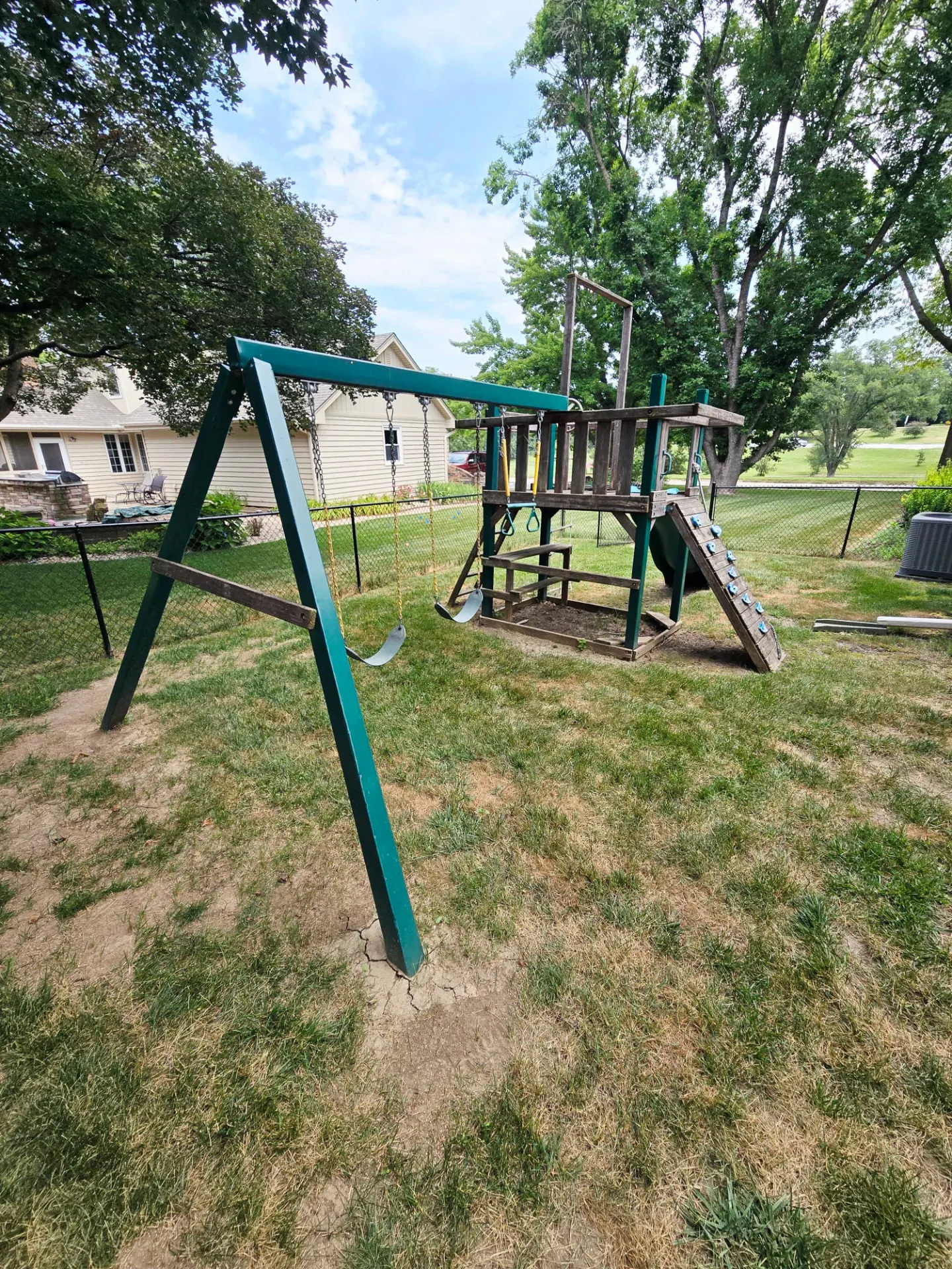 Metal swing set and playset ready for removal, Omaha