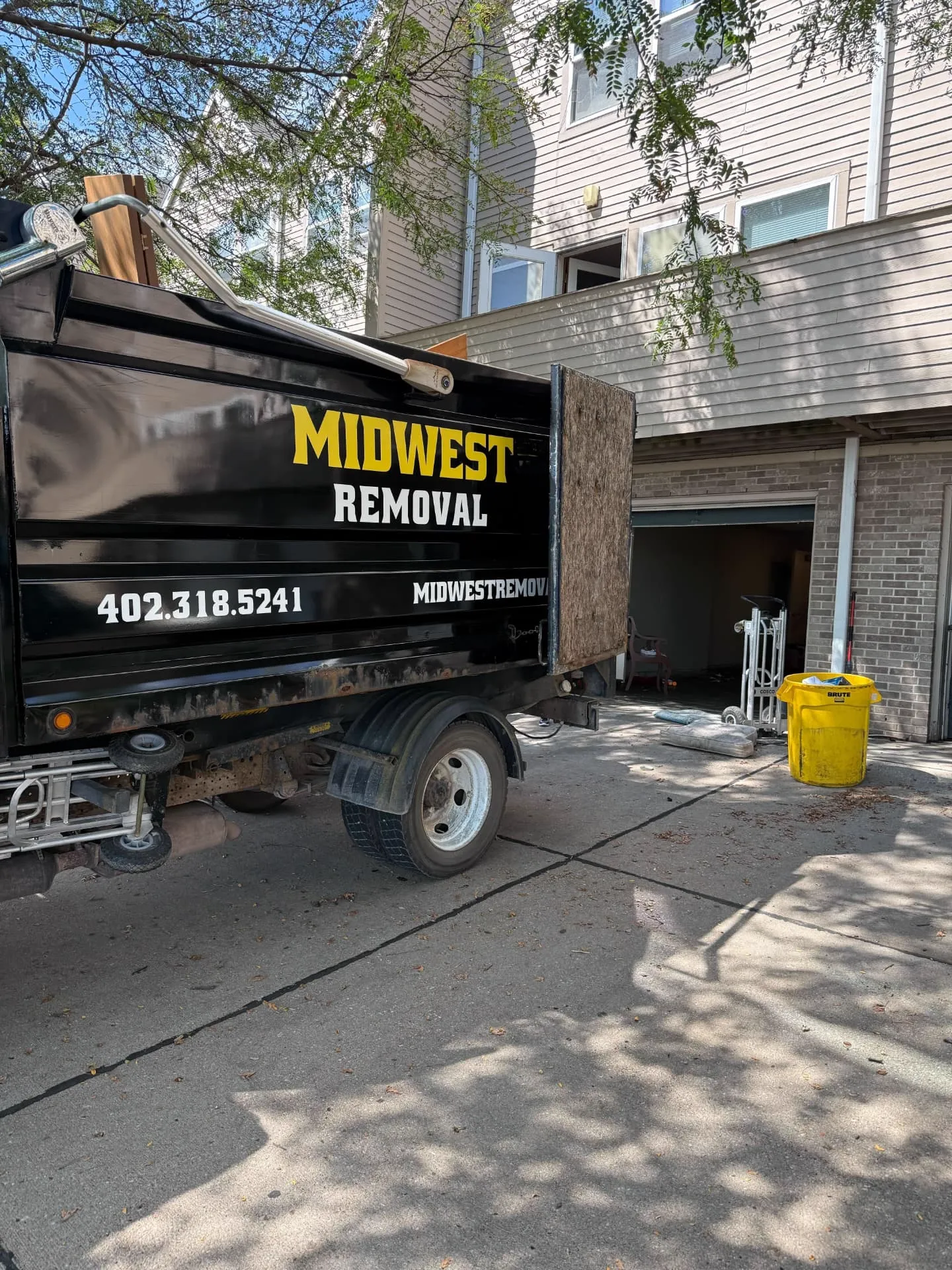 Dump truck loaded during a townhome unit turnover