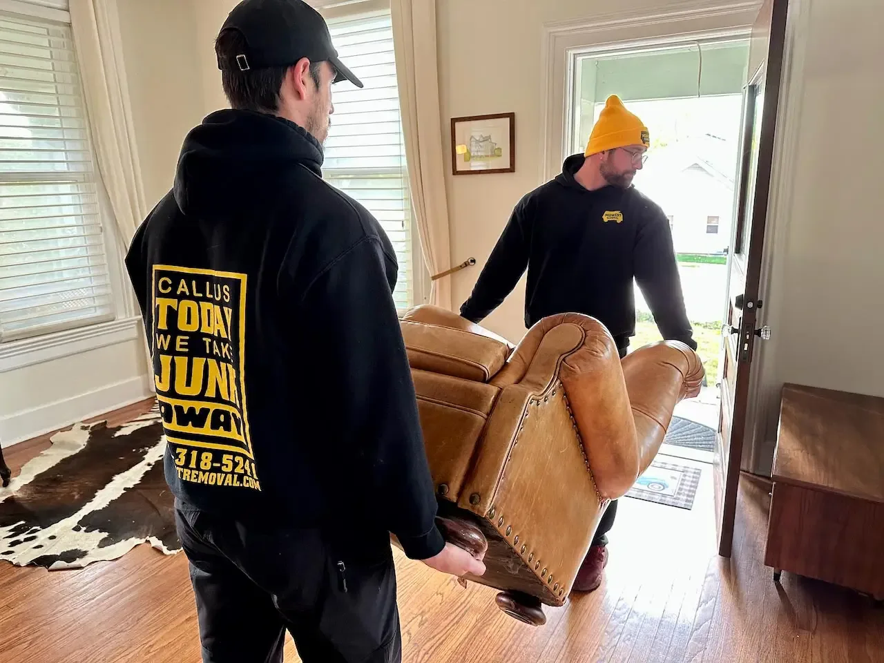 Carrying an armchair out of a home, Omaha
