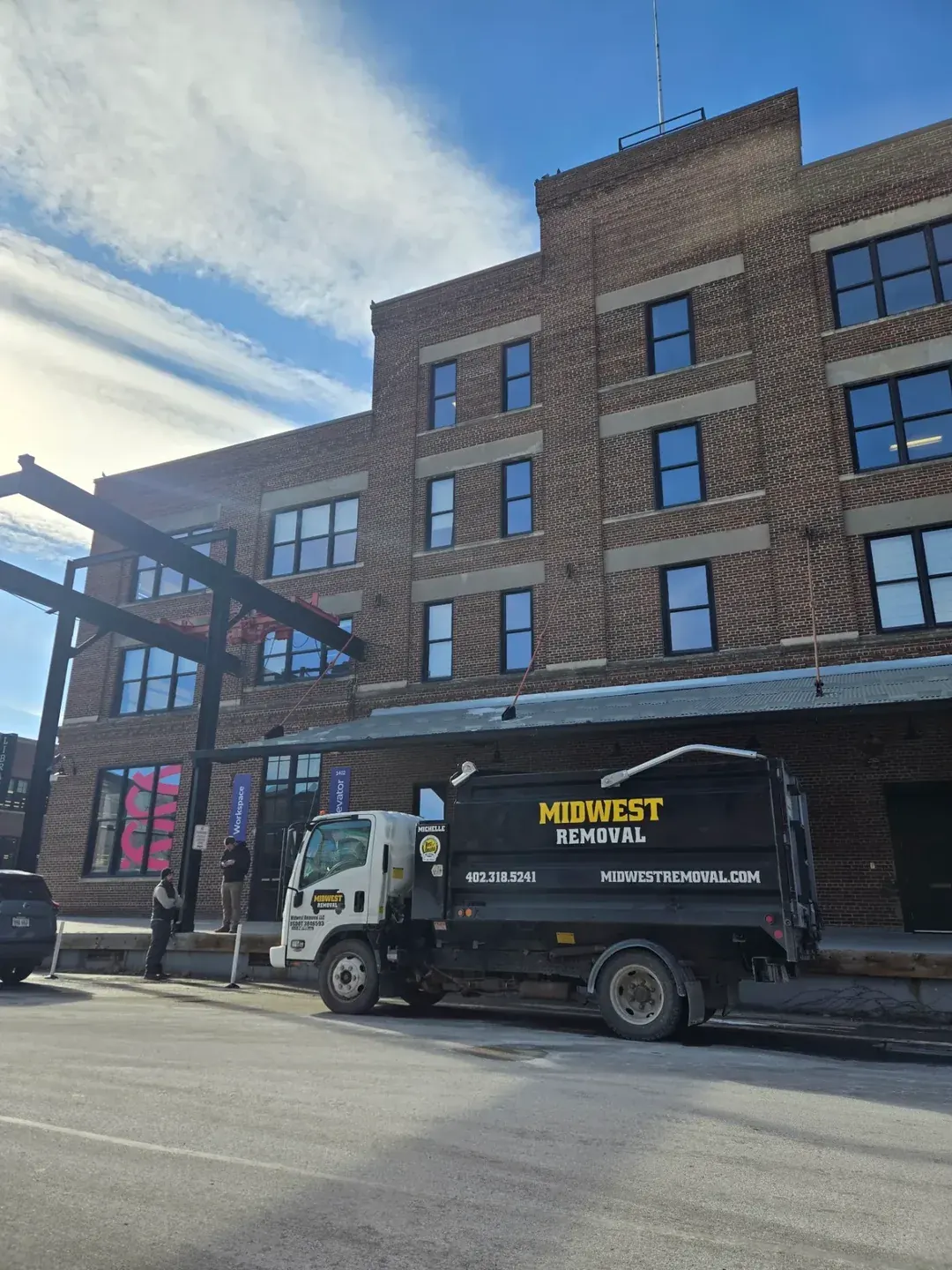 Midwest Removal truck at a downtown workspace building, Omaha
