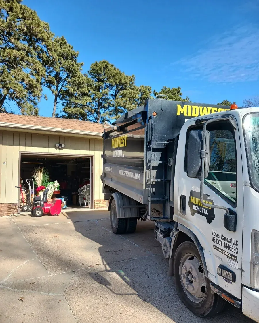 Midwest Removal truck parked at an Omaha garage cleanout