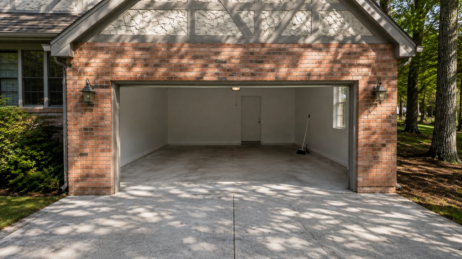 Empty, swept two car garage at a Papillion home after a full cleanout by Midwest Removal