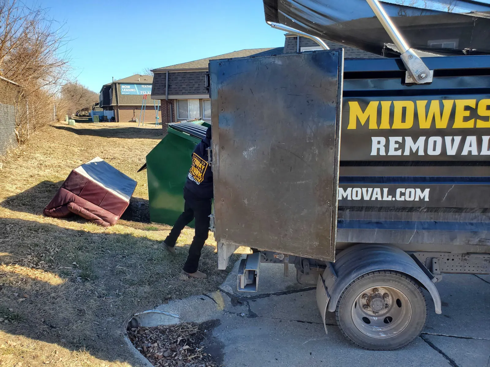 Midwest Removal trailer being loaded during a Bennington cleanout