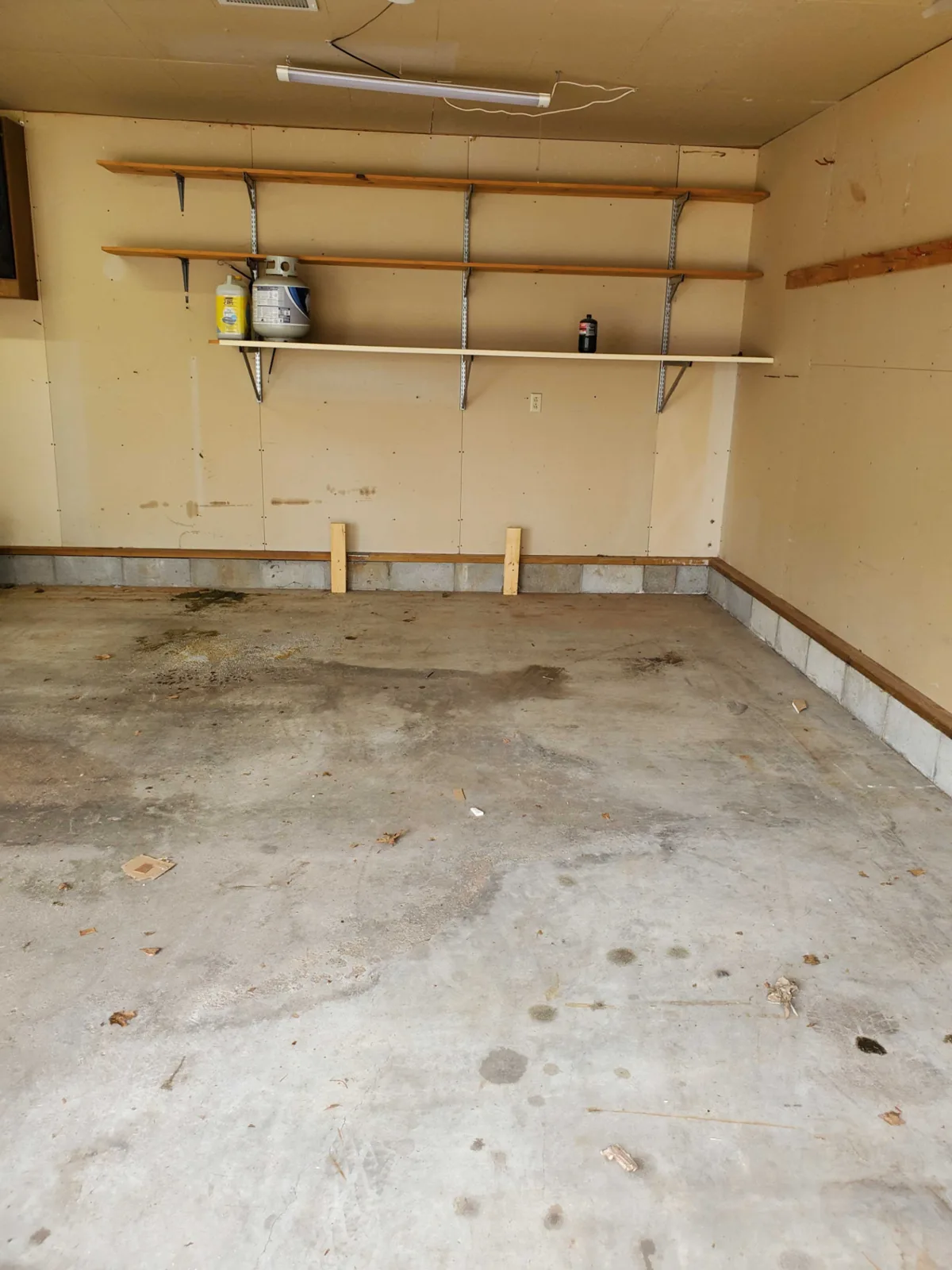 Garage cleared down to the bare floor after the cleanout, Omaha