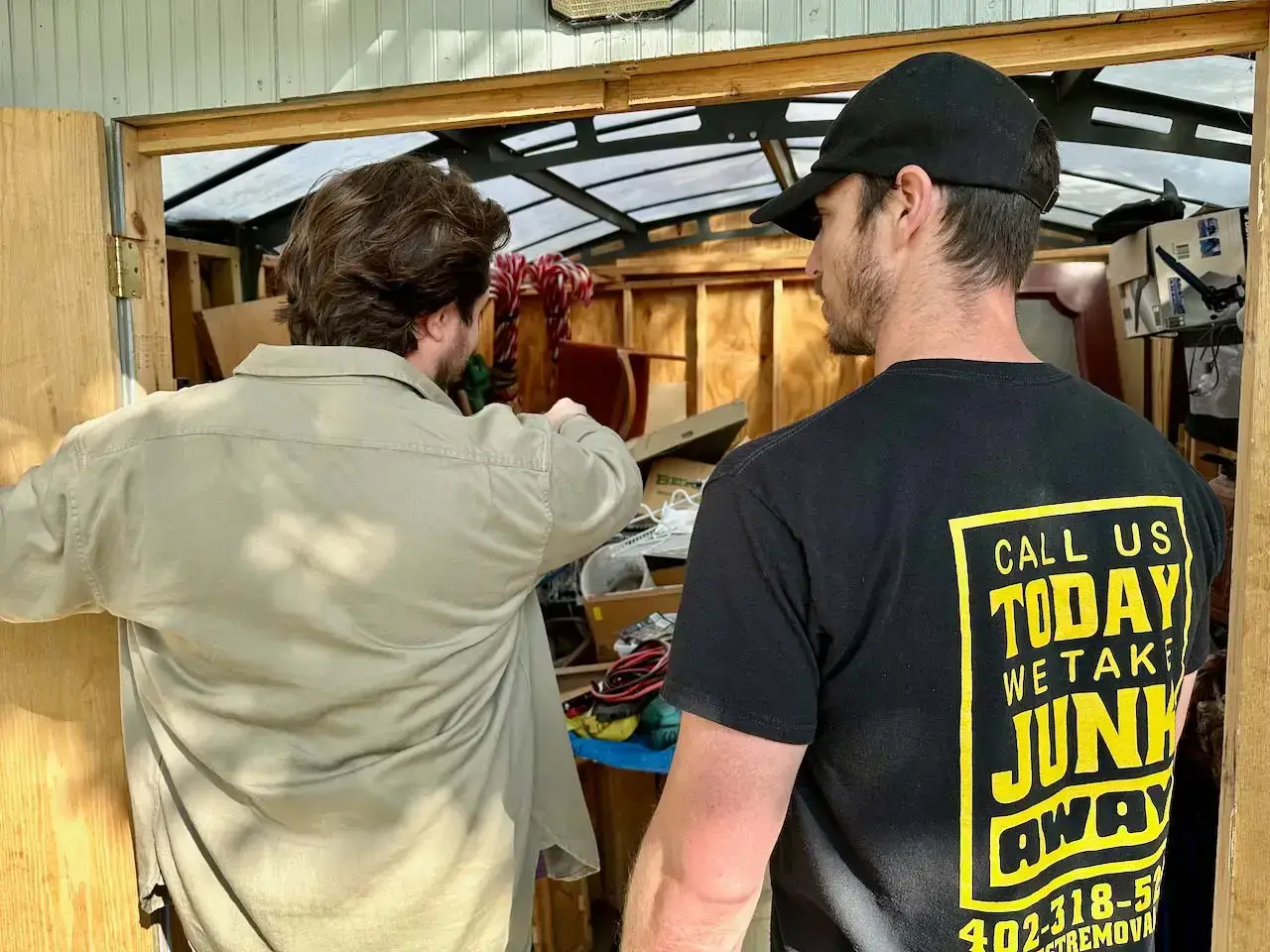 Crew sorting through a packed storage room, Bellevue