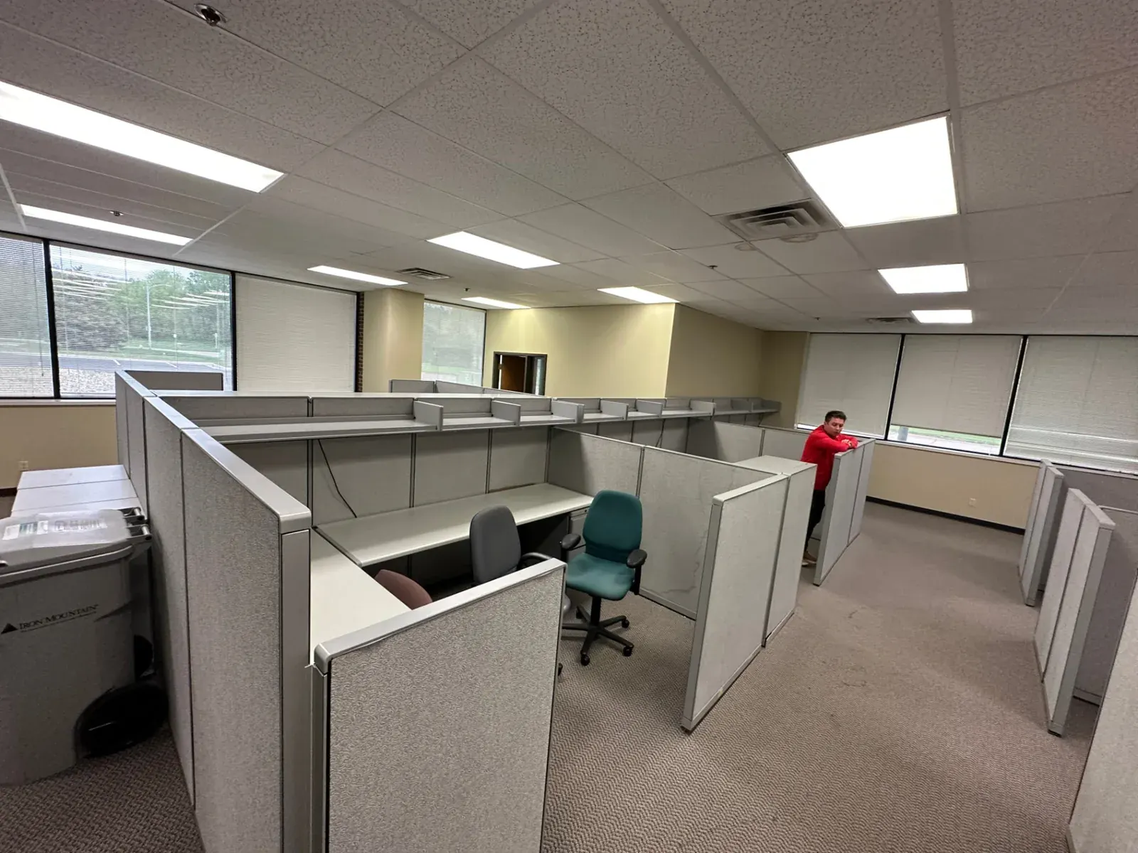Cubicle workstations being cleared from an office floor, Omaha