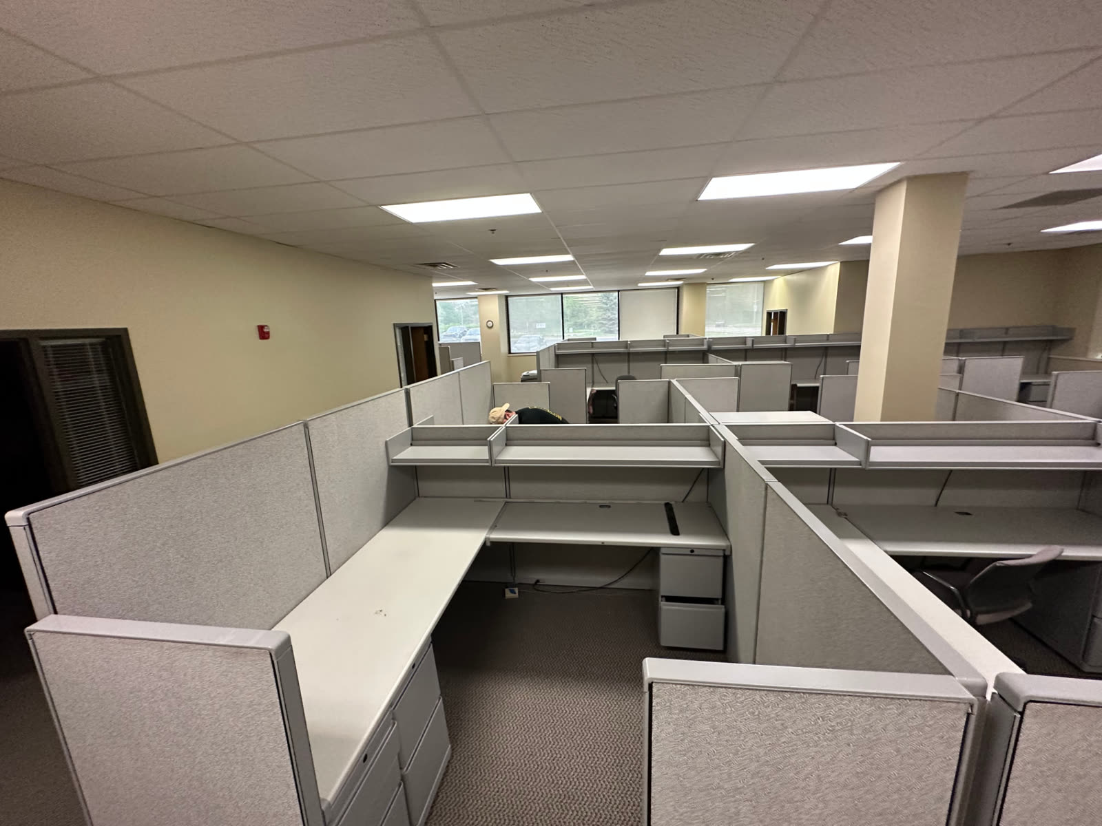 Open office floor with cubicle workstations ready for removal