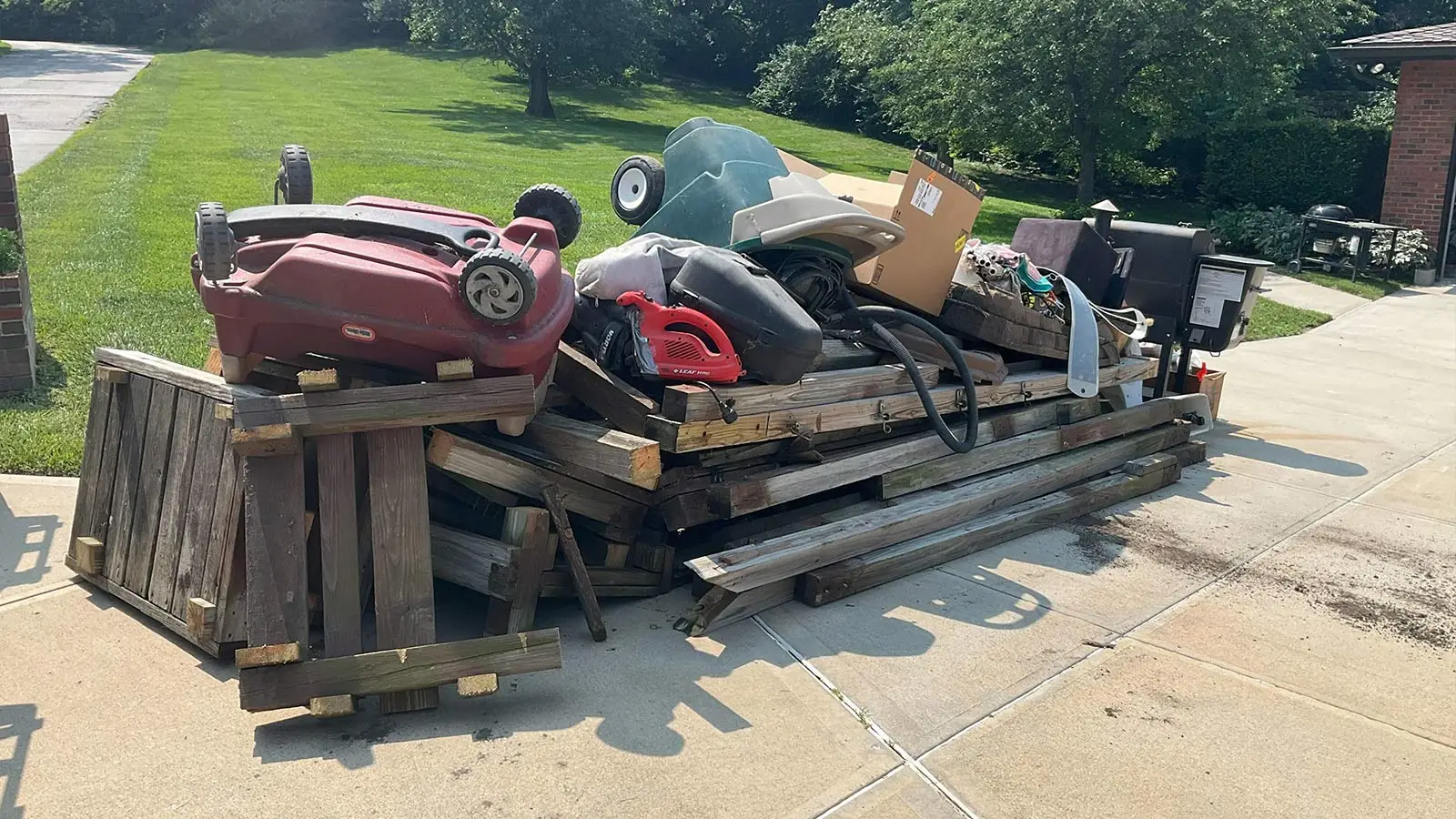 Garage packed with bulky household junk before an Omaha cleanout